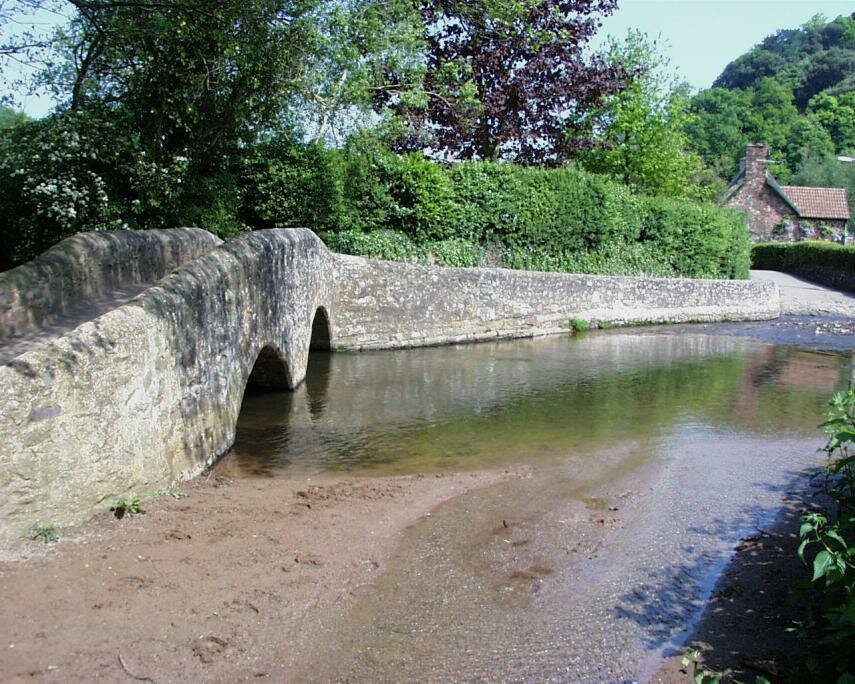 View of Gallox Medieval Packhorse Bridge over the River Avill, Dunster, Somerset