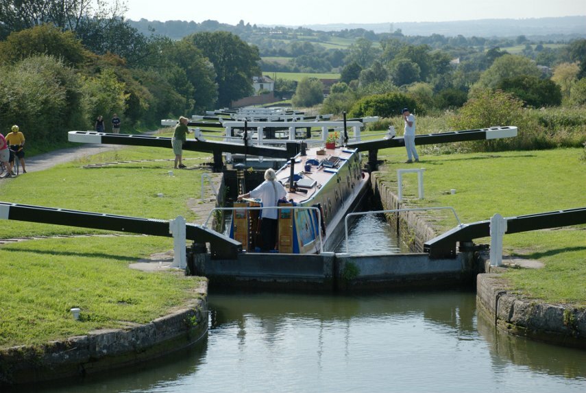 Picture of a narrowboat working its way down Caen Hill Locks, Rowde, Devizes, Wiltshire, England