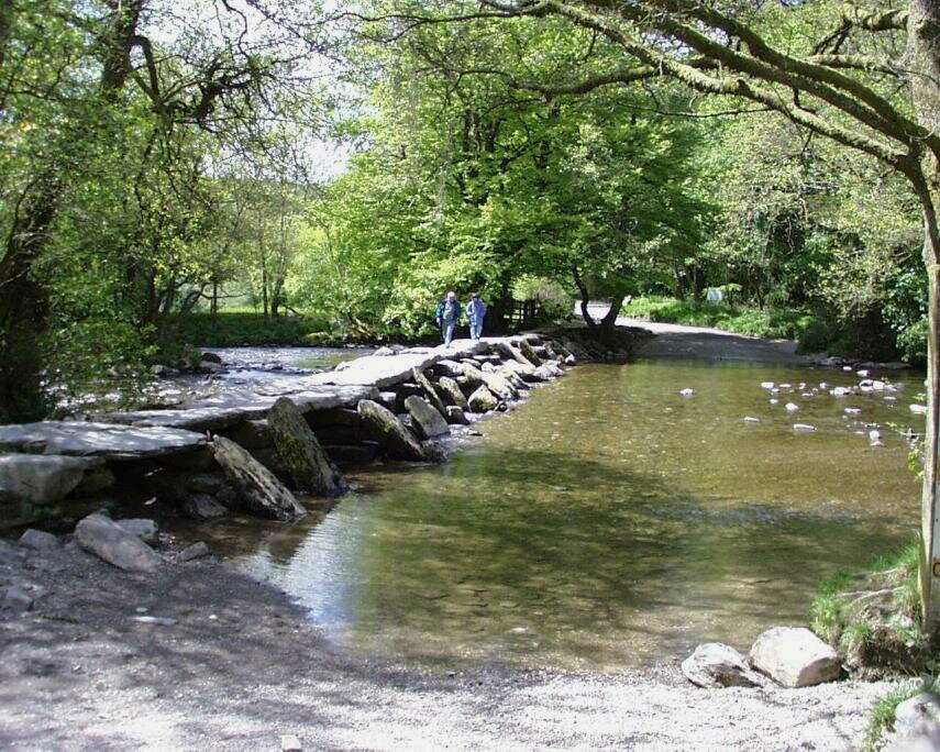 View of Tarr Steps Clapper Bridge crossing the River Barle, Exmoor, Somerset