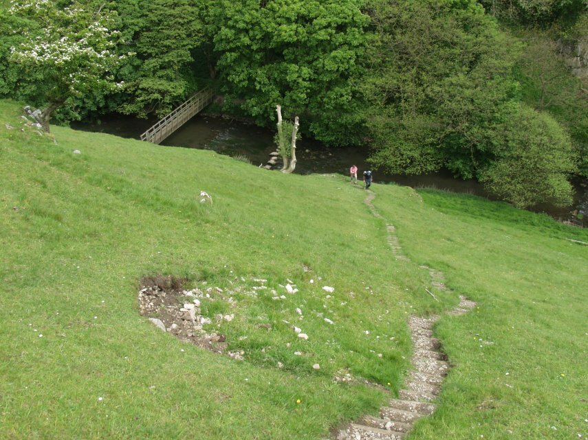 Scene showing stepping stones in Wolfscote Dale, Hartington, Peak District, Derbyshire, England