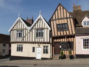 Historic half-timbered buildings, including The Crooked House, High Street, Lavenham, Suffolk, England